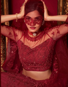 Crimson Red Net Bridal Lehenga with 3D Floral Embroidery 3.webp